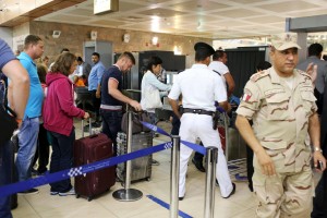 An Egyptian army soldier is seen as Russian passengers, who just finished their holidays, leave at the airport of the Red Sea resort of Sharm el-Sheikh, November 6, 2015. President Vladimir Putin ordered the suspension of all Russian passenger flights to Egypt on Friday until the cause of a deadly plane crash at the weekend was established. REUTERS/Asmaa Waguih